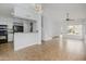 Open-concept living area with a bar, a staircase, and access to the kitchen area at 18823 N 41St Dr, Glendale, AZ 85308