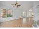 Bright and airy living room with tile flooring, ceiling fan, and views to the backyard at 18823 N 41St Dr, Glendale, AZ 85308