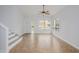Open concept living room features tile flooring, staircase, and natural light at 18823 N 41St Dr, Glendale, AZ 85308