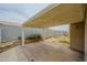 Covered patio with interlocking brick flooring and well-maintained landscaping at 18823 N 41St Dr, Glendale, AZ 85308