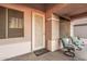 Welcoming front porch with decorative door, dual chairs, and inviting facade at 1939 S Noble --, Mesa, AZ 85209