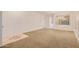 Bright living room featuring neutral walls, plush carpeting, and elegant chandelier at 1939 S Noble --, Mesa, AZ 85209