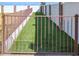 Fenced backyard featuring green turf with walls made of brick and concrete at 19450 E Silver Creek Ln, Queen Creek, AZ 85142