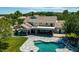 Aerial view of backyard featuring a pool, a covered patio and lush landscaping at 19450 E Silver Creek Ln, Queen Creek, AZ 85142