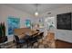 Cozy dining area with a built-in bench, stylish decor, and hardwood floors, perfect for Gathering meals at 19450 E Silver Creek Ln, Queen Creek, AZ 85142