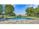 Beautiful backyard pool with a stunning rock waterfall feature at 19450 E Silver Creek Ln, Queen Creek, AZ 85142