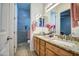 Bathroom featuring double vanity with granite countertop and shower at 21186 E Sunset Dr, Queen Creek, AZ 85142