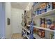 Walk-in pantry offers ample storage space for food and household items at 21186 E Sunset Dr, Queen Creek, AZ 85142