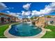 Backyard featuring a custom pool with a rock waterfall and waterslide at 21186 E Sunset Dr, Queen Creek, AZ 85142