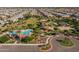 Aerial view of community amenities including pool, playground, green space, and shaded picnic areas at 21512 S 225Th Way, Queen Creek, AZ 85142