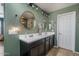 Bathroom featuring double sinks, neutral walls, hard wood floors, and modern fixtures for a luxurious feel at 21512 S 225Th Way, Queen Creek, AZ 85142