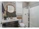 Stylish bathroom featuring a modern vanity, stylish mirror, and sleek glass-enclosed shower for a spa-like experience at 21512 S 225Th Way, Queen Creek, AZ 85142