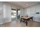 Bright dining area with sliding glass doors that open to an outdoor patio and yard at 21512 S 225Th Way, Queen Creek, AZ 85142