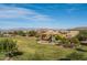 Neighborhood park featuring a playground, covered picnic area, and green space for recreational activities, with mountains in the distance at 21512 S 225Th Way, Queen Creek, AZ 85142