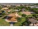 Aerial view of a community park featuring playgrounds, sand volleyball, and picnic pavilions in a well-maintained neighborhood at 21512 S 225Th Way, Queen Creek, AZ 85142