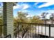 View from the balcony showing lush green trees and a clear blue sky at 2315 W Union Hills Dr # 119, Phoenix, AZ 85027