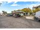 Apartment complex with covered parking showing tidy landscaping, and a view of multiple resident vehicles at 2315 W Union Hills Dr # 119, Phoenix, AZ 85027