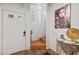 Bright foyer featuring a decorative door with sidelights and unique artistic accents at 2315 W Union Hills Dr # 119, Phoenix, AZ 85027