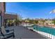 Beautiful backyard view with a refreshing swimming pool, cozy seating area, and lush landscaping at 2678 E Firestone Dr, Chandler, AZ 85249