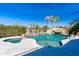 Backyard pool featuring a rock waterfall, a jacuzzi, and lush tropical landscaping at 2678 E Firestone Dr, Chandler, AZ 85249