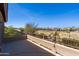 Balcony with a metal railing and textured wall offering scenic views of the community and golf course at 2678 E Firestone Dr, Chandler, AZ 85249