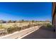 Balcony with metal railing and views overlooking a community and golf course on a bright day at 2678 E Firestone Dr, Chandler, AZ 85249