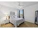 Cozy bedroom featuring neutral tones, with a queen-sized bed, bedside table, artwork, and a calming atmosphere at 2678 E Firestone Dr, Chandler, AZ 85249