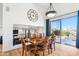 Dining area featuring wood floors, stylish table set and an open-concept design at 2678 E Firestone Dr, Chandler, AZ 85249