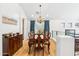 Elegant dining room features a wooden table, chandelier, and plenty of natural light at 2678 E Firestone Dr, Chandler, AZ 85249