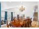 A dining room featuring a large wooden table, decorative lighting, and a view from the second story at 2678 E Firestone Dr, Chandler, AZ 85249