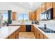 Well-lit kitchen with a large window, stainless steel appliances, white countertops, and plenty of storage at 2678 E Firestone Dr, Chandler, AZ 85249