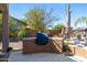 Outdoor kitchen under covered patio offers plenty of countertop space and shade at 2678 E Firestone Dr, Chandler, AZ 85249