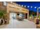 This covered patio includes a ceiling fan, an outdoor kitchen, and direct access to an interior living space at 2678 E Firestone Dr, Chandler, AZ 85249