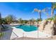 Inviting pool area with rock waterfall feature, surrounded by lush landscaping at 2678 E Firestone Dr, Chandler, AZ 85249