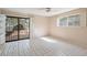 Serene bedroom with sliding glass door to a courtyard and tile flooring at 3022 E Weldon Ave, Phoenix, AZ 85016