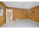 Bedroom featuring white tile floors, ceiling fan, vibrant yellow walls, and two access doors at 3022 E Weldon Ave, Phoenix, AZ 85016