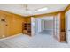 Bedroom boasts white tile floors, ceiling fan, bright yellow walls, and doorway access to other rooms at 3022 E Weldon Ave, Phoenix, AZ 85016