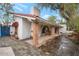 Charming white stucco home with red tile roof and brick pillars highlighting the outdoor patio area at 3022 E Weldon Ave, Phoenix, AZ 85016