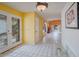 Bright hallway featuring arched doorways, tile flooring, and ample natural light at 3022 E Weldon Ave, Phoenix, AZ 85016