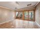 Living room with tiled floor and glass patio doors offering outdoor view at 3022 E Weldon Ave, Phoenix, AZ 85016