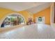 Bright living room with arched windows, fountain view, and tile flooring at 3022 E Weldon Ave, Phoenix, AZ 85016