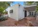 Cozy patio space with brick flooring, privacy walls, and outdoor seating at 3022 E Weldon Ave, Phoenix, AZ 85016