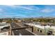 An aerial view of the Melrose district, showcasing the neighborhood, surrounding buildings, and beautiful mountain views in the background at 309 W Campbell Ave, Phoenix, AZ 85013