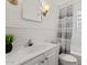 Bathroom featuring a tub/shower combo, tiled walls and classic vanity at 309 W Campbell Ave, Phoenix, AZ 85013