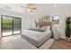 Large main bedroom features a ceiling fan, and sliding glass door to the backyard at 309 W Campbell Ave, Phoenix, AZ 85013