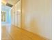 Hallway with tan tiled flooring and storage cabinets at 3133 N 81St Ave, Phoenix, AZ 85033