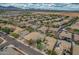 Wide aerial view of the neighborhood featuring many single Gathering homes, desert landscaping, and mountain views at 3712 S 104Th Ln, Tolleson, AZ 85353