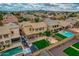 Aerial view of the property showcasing a spacious backyard, patio, and swimming pool in a well-maintained community at 3712 S 104Th Ln, Tolleson, AZ 85353