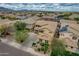 Panoramic aerial view of a two-story home showcasing its manicured front yard and lengthy driveway at 3712 S 104Th Ln, Tolleson, AZ 85353