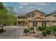 Charming two-story home featuring a neutral color palette, tidy landscaping, and spacious driveway with walkway at 3712 S 104Th Ln, Tolleson, AZ 85353